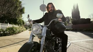 Angus Sampson as Cisco on a motorcycle in The Lincoln Lawyer season 3