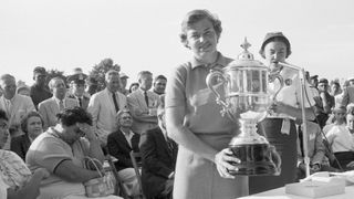 Miss Betsy Rawls of Spartanburg, South Carolina receives the winner's trophy after the final round of the 1957 Women's National Open