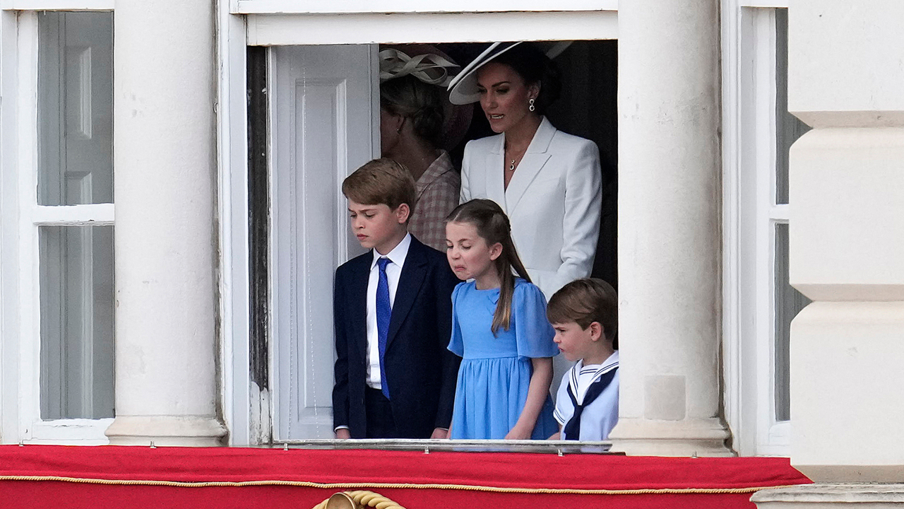 Britain&#039;s Catherine, Duchess of Cambridge stands with her children Britain&#039;s Prince George of Cambridge, Britain&#039;s Princess Charlotte of Cambridge and Britain&#039;s Prince Louis of Cambridge watch overlooking Horse Guards as the troops march past during the Queen&#039;s Birthday Parade, the Trooping the Colour, as part of Queen Elizabeth II&#039;s platinum jubilee celebrations, in London on June 2, 2022. - Huge crowds converged on central London in bright sunshine on Thursday for the start of four days of public events to mark Queen Elizabeth II&#039;s historic Platinum Jubilee, in what could be the last major public event of her long reign.