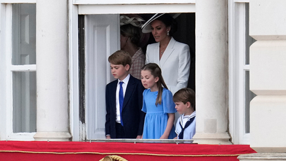 Britain's Catherine, Duchess of Cambridge stands with her children Britain's Prince George of Cambridge, Britain's Princess Charlotte of Cambridge and Britain's Prince Louis of Cambridge watch overlooking Horse Guards as the troops march past during the Queen's Birthday Parade, the Trooping the Colour, as part of Queen Elizabeth II's platinum jubilee celebrations, in London on June 2, 2022. - Huge crowds converged on central London in bright sunshine on Thursday for the start of four days of public events to mark Queen Elizabeth II's historic Platinum Jubilee, in what could be the last major public event of her long reign.