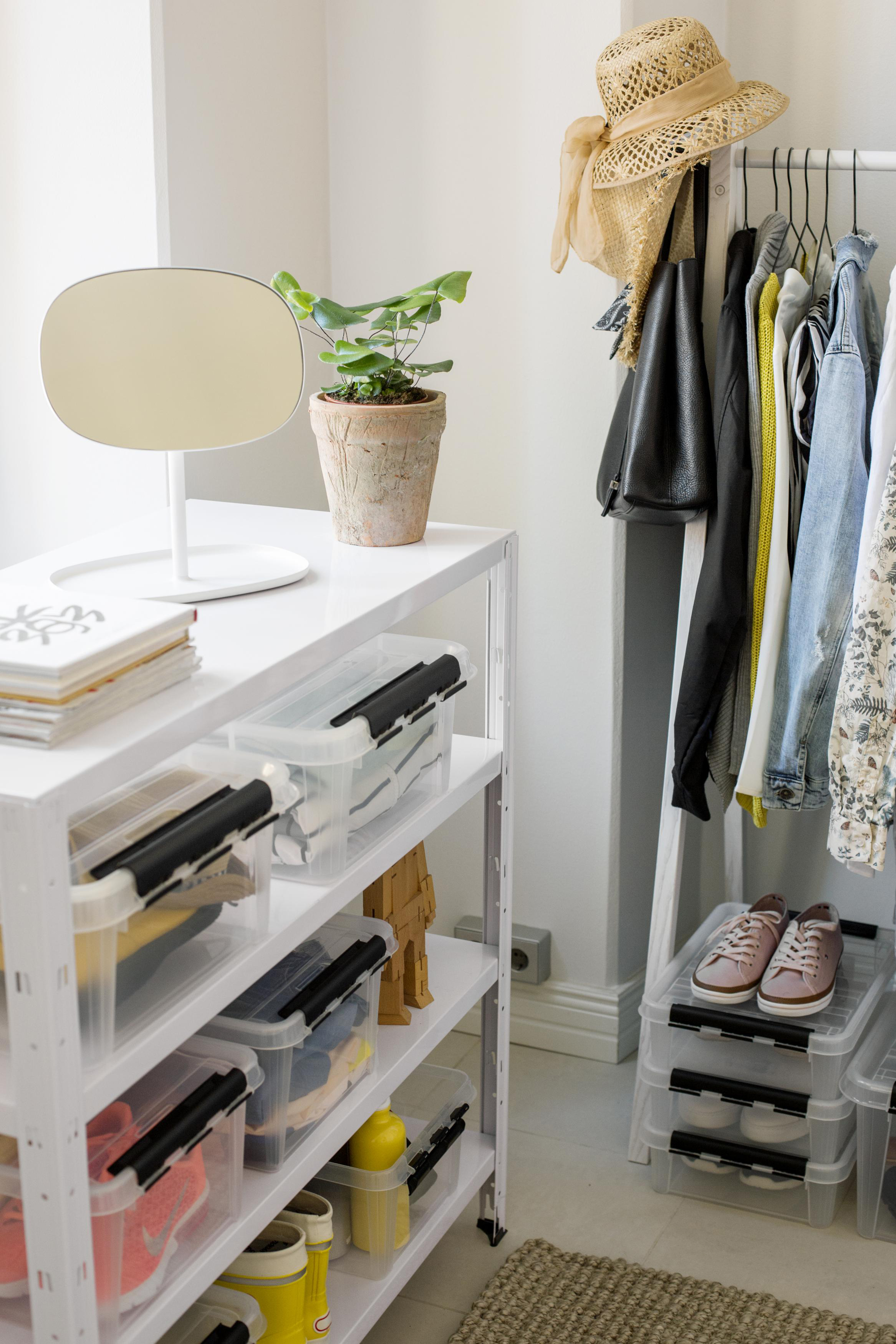 storage boxes in a walk in wardrobe