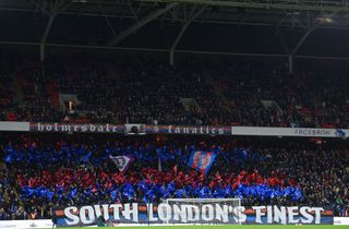 A general view inside the stadium as fans of Crystal Palace displays banners in support of their side prior to the Premier League match between Crystal Palace and Everton at Selhurst Park on December 12, 2021 in London, England.