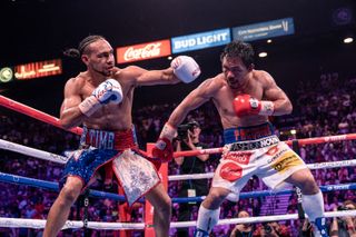 Keith Thurman (L) versus Manny Pacquiao in 2019 fight 
