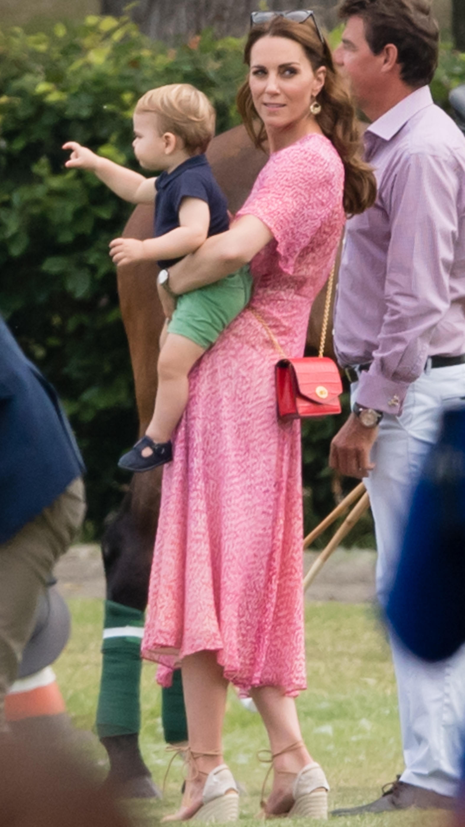 Catherine, Princess of Wales holds Prince Louis as they attend The King Power Royal Charity Polo Day at Billingbear Polo Club on July 10, 2019