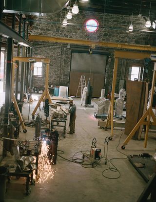 Assistants at work in Bove’s studio, a former brick factory