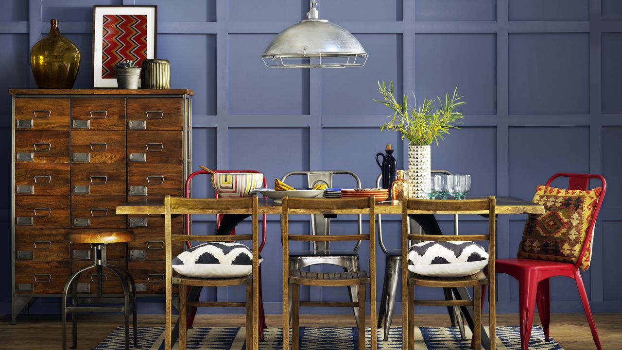 dining room with faux panel walls painted blue