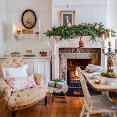 vintage style dining room dressed for christmas with decorated fireplace
