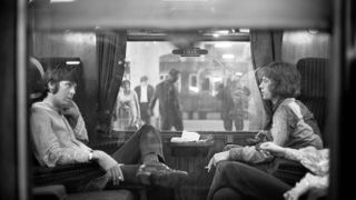 Paul McCartney and Mick Jagger on a train from London Euston station to Bangor on 25 August, 1967