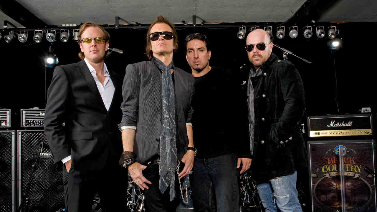 Black Country Communion posing for a photograph in 2011