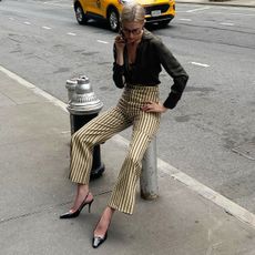 Christie Tyler wearing striped trousers