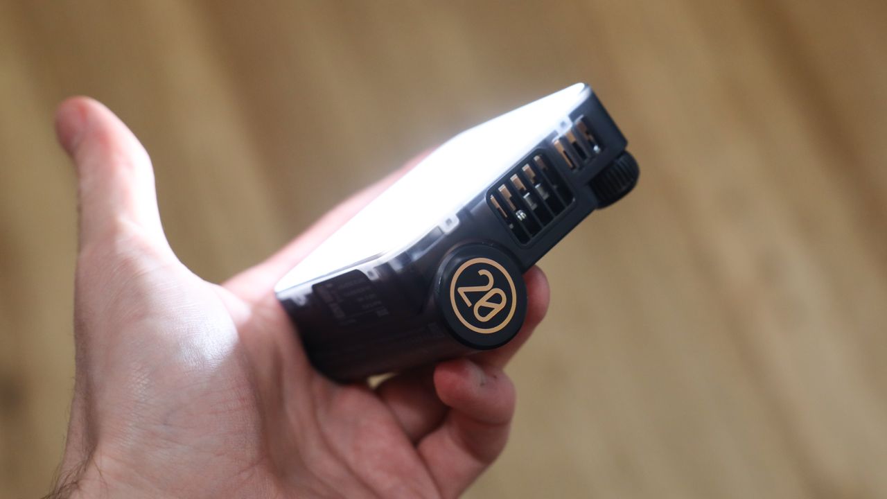 Zhiyun FIVERAY M20C LED panel side view held in a hand