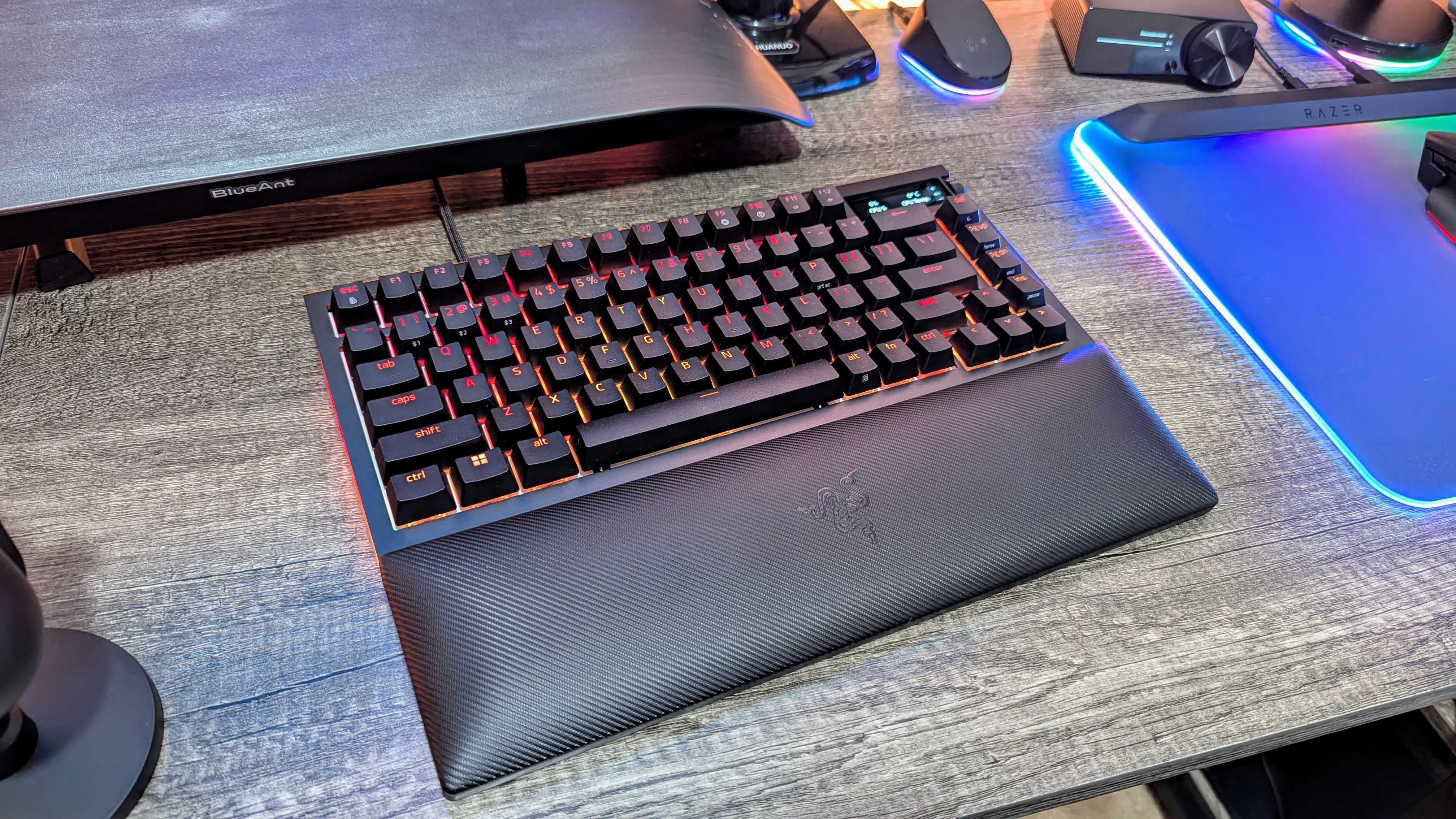 The Razer BlackWidow V4 Pro 75% on a desk with its wrist rest.