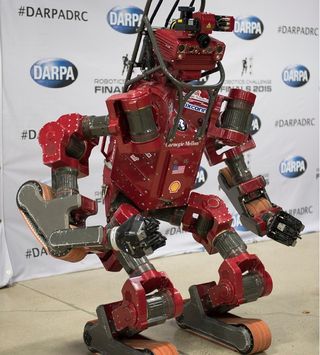 Team Tartan Rescue's CHIMP robot, from Carnegie Mellon University, took the lead on the first day of the DARPA robotics challenge.