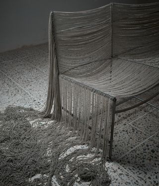 Chair with silver beads on by Ana Mendieta