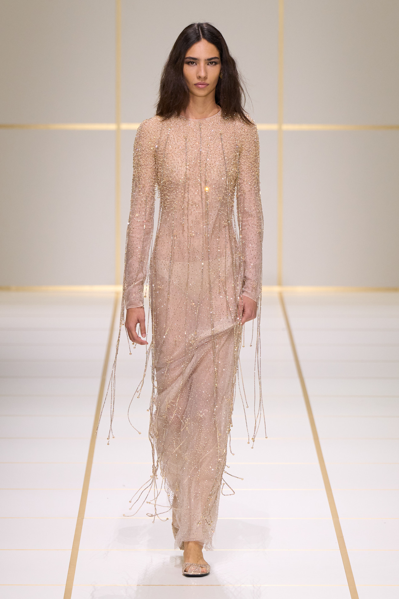 a model walks the giorgio armani s/s 27 runway.