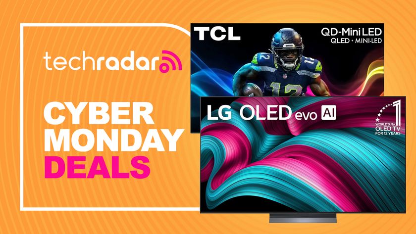 LG and TCL TVs with a sign saying Cyber Monday deals