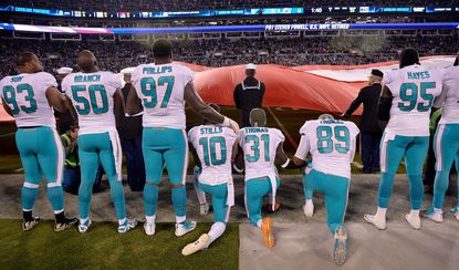 NFL owners approve rules with team fines for anthem protests.