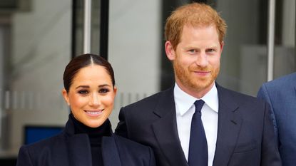 Prince Harry and Meghan Markle pose for the camera. Photo by Gotham / GC Images for Getty Images.