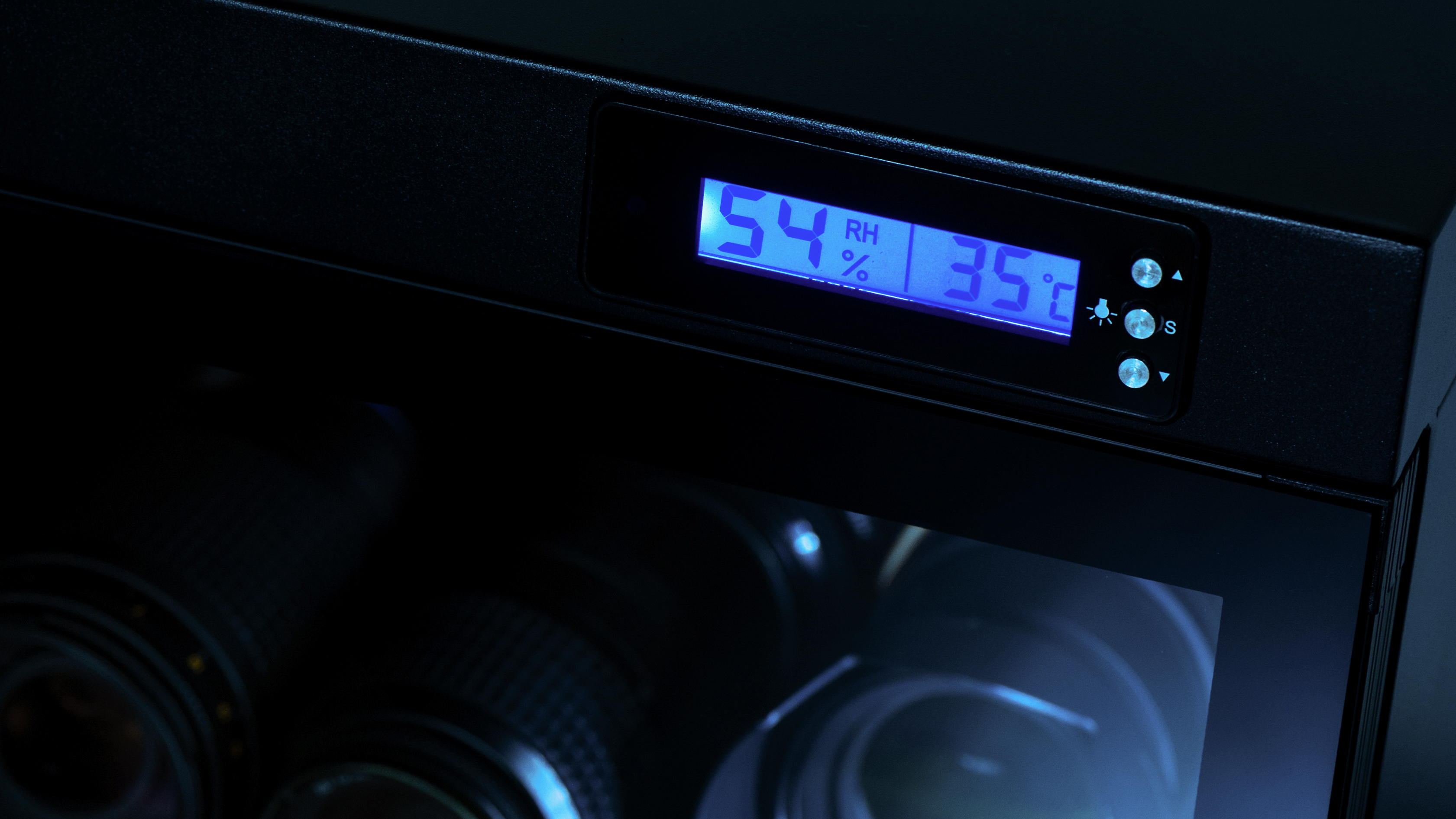 electronic dehumidify dry cabinet for storage cameras lens and other photography equipment. Closeup at status display of the cabinet.