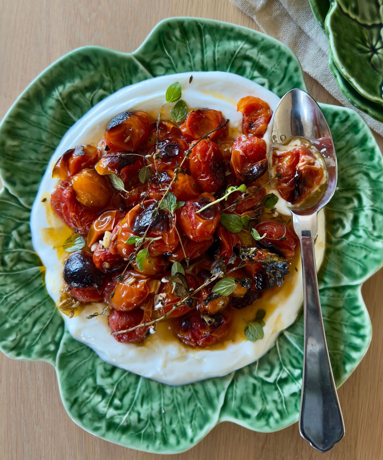 Tomato and yogurt dish on green plate