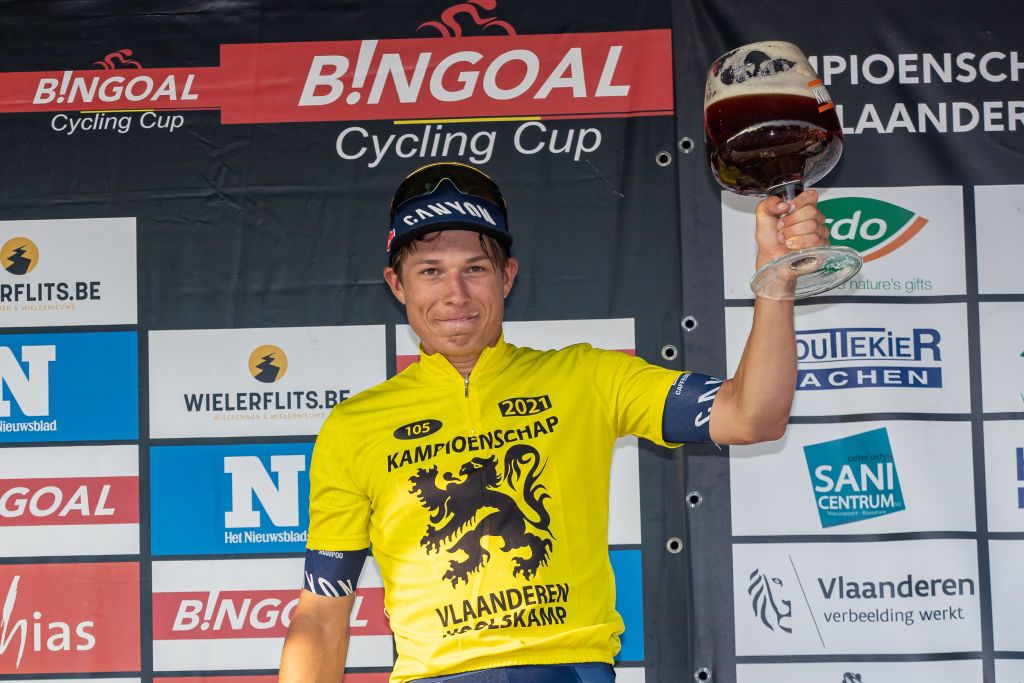 Belgian Jasper Philipsen of AlpecinFenix celebrates on the podium after winning the 105th edition of the Kamioenschap van Vlaanderen one day cycling race 1953 km from Koolskamp to Koolskamp Friday 17 September 2021 the eighth stage out of 9 of the Bingoal cycling cup BELGA PHOTO KURT DESPLENTER Photo by KURT DESPLENTERBELGA MAGAFP via Getty Images