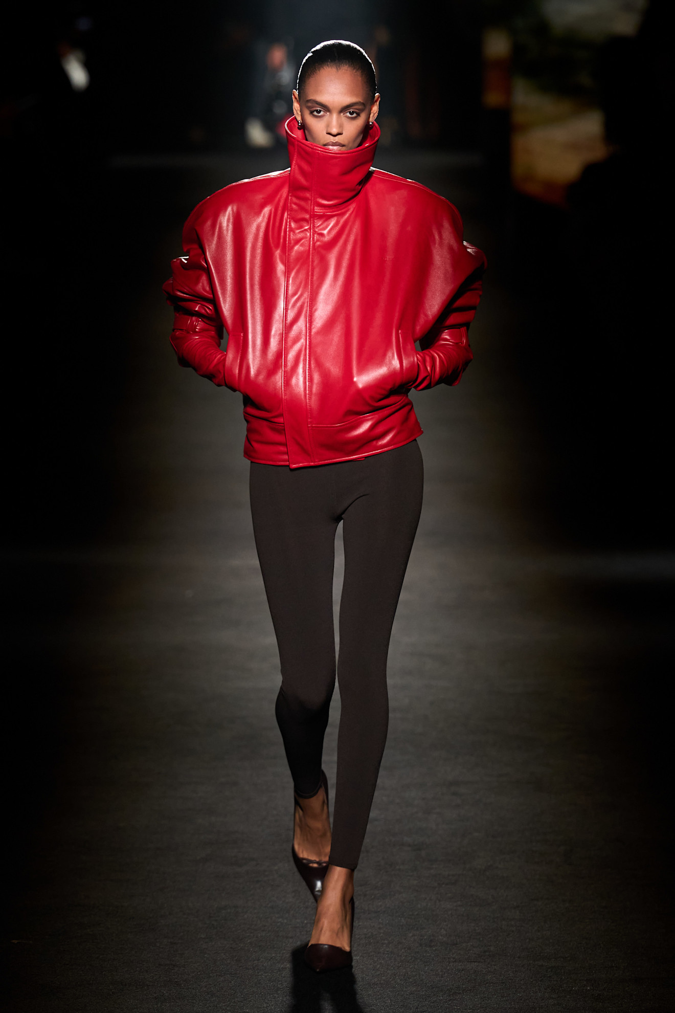 A model wore the red-and-black color combination trend on the Balenciaga Fall 2026 runway