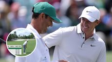 Rory McIlroy speaks with his caddie