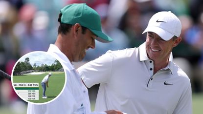 Rory McIlroy speaks with his caddie