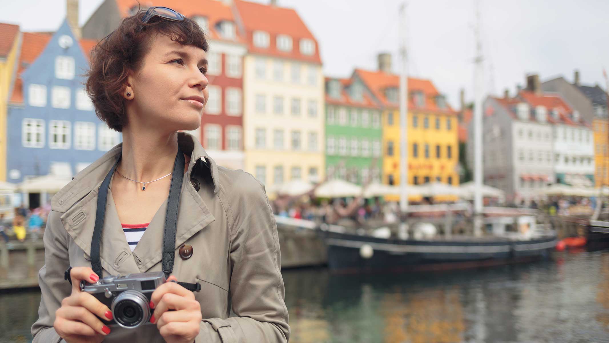 Woman with mirrorless camera in hand