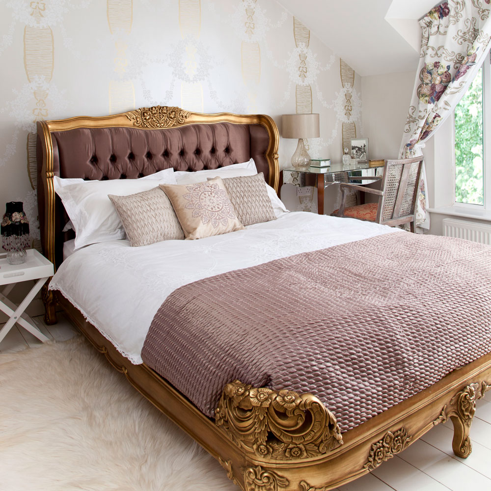 bedroom with wooden flooring and golden cot