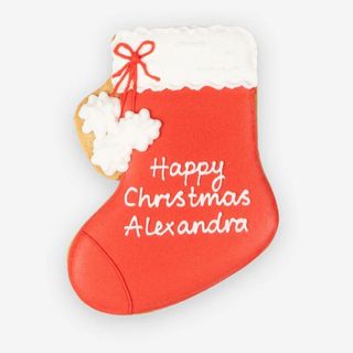 personalised gifts red and white stocking iced biscuit reading happy christmas alexandra
