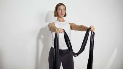 Personal trainer Louisa Drake perpares for an upper body resistance band workout