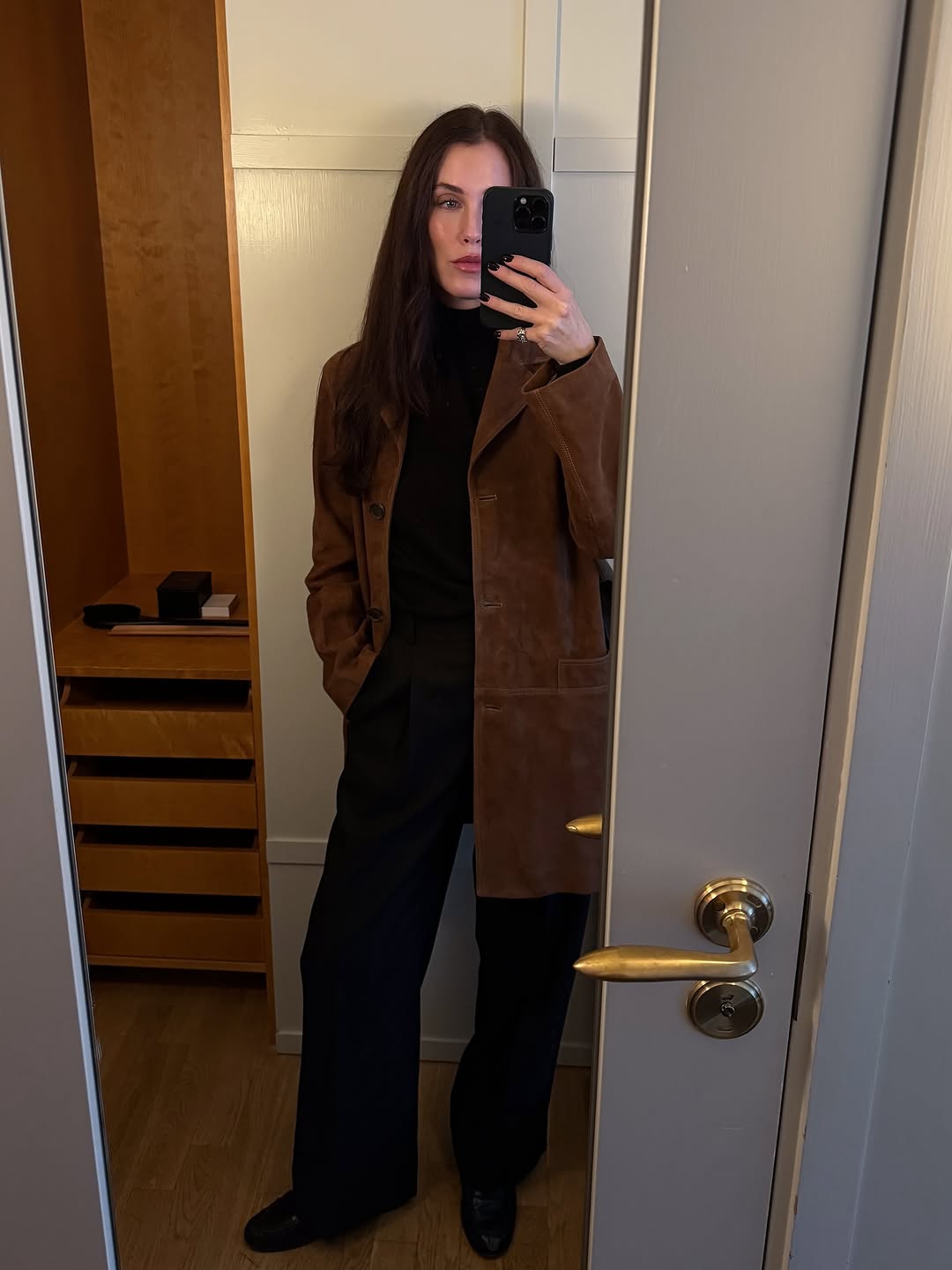 woman wearing brown suede jacket trend