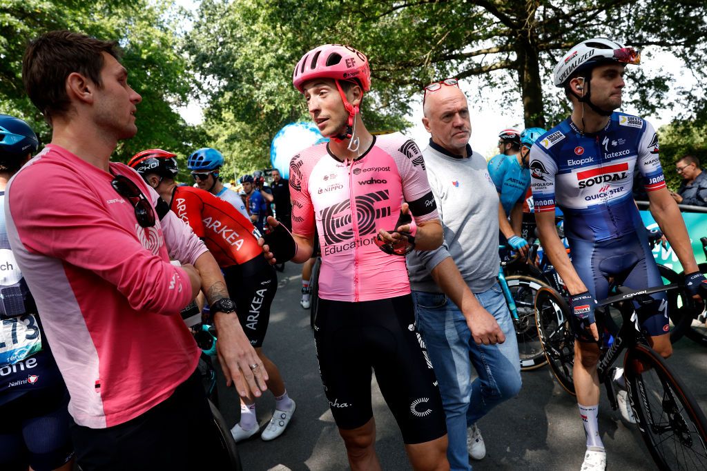 BILZEN BELGIUM AUGUST 27 LR Tejay van Garderen of United States sports director of Team EF EducationEasypost Jens Keukeleire of Belgium and Team EF EducationEasypost and the peloton stopped at the finish line to protest as riders deem the course as being too dangerous during the 19th Renewi Tour 2023 Stage 5 a 1873km stage from Riemst to Bilzen UCIWT on August 27 2023 in Bilzen Belgium Photo by Bas CzerwinskiGetty Images