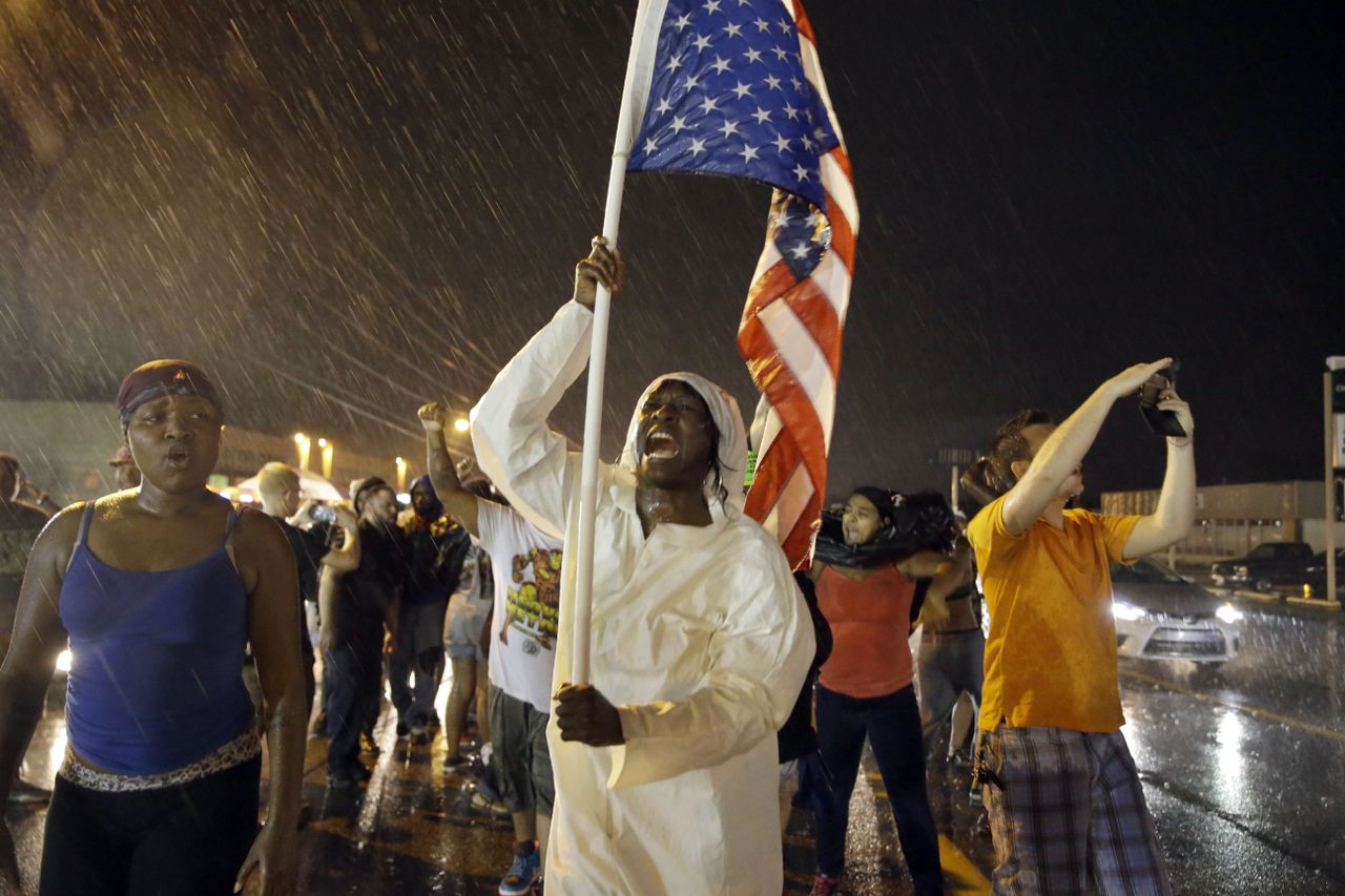 Protesters mark the one-year anniversary of Michael Brown&amp;#039;s death.