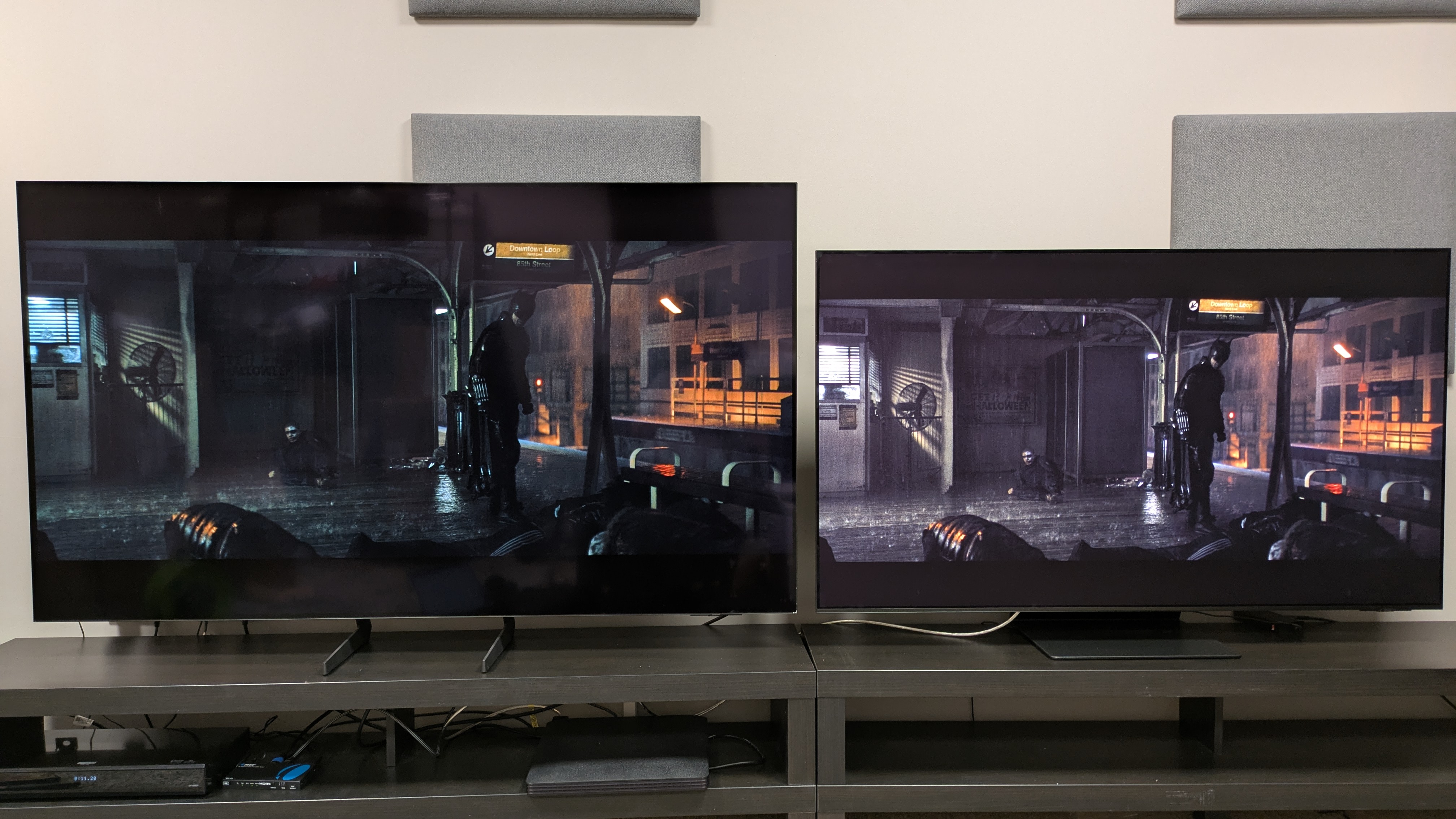 Samsung S85F (left) vs Samsung S95F (right) showing the subway fight scene from The Batman with both TVs in bright conditions