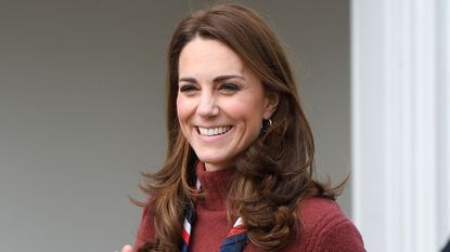 Catherine, Princess of Wales smiles as she departs after visiting the Scouts&rsquo; headquarters at Gilwell Park