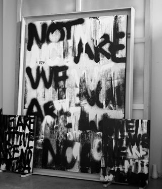 black and white picture of spray painting words