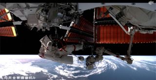 One of China's Shenzhou 15 astronauts works outside the Tiangong space station during the mission's third spacewalk, which the nation revealed on March 30, 2023.