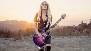 Orianthi holds her signature PRS Private Stock model