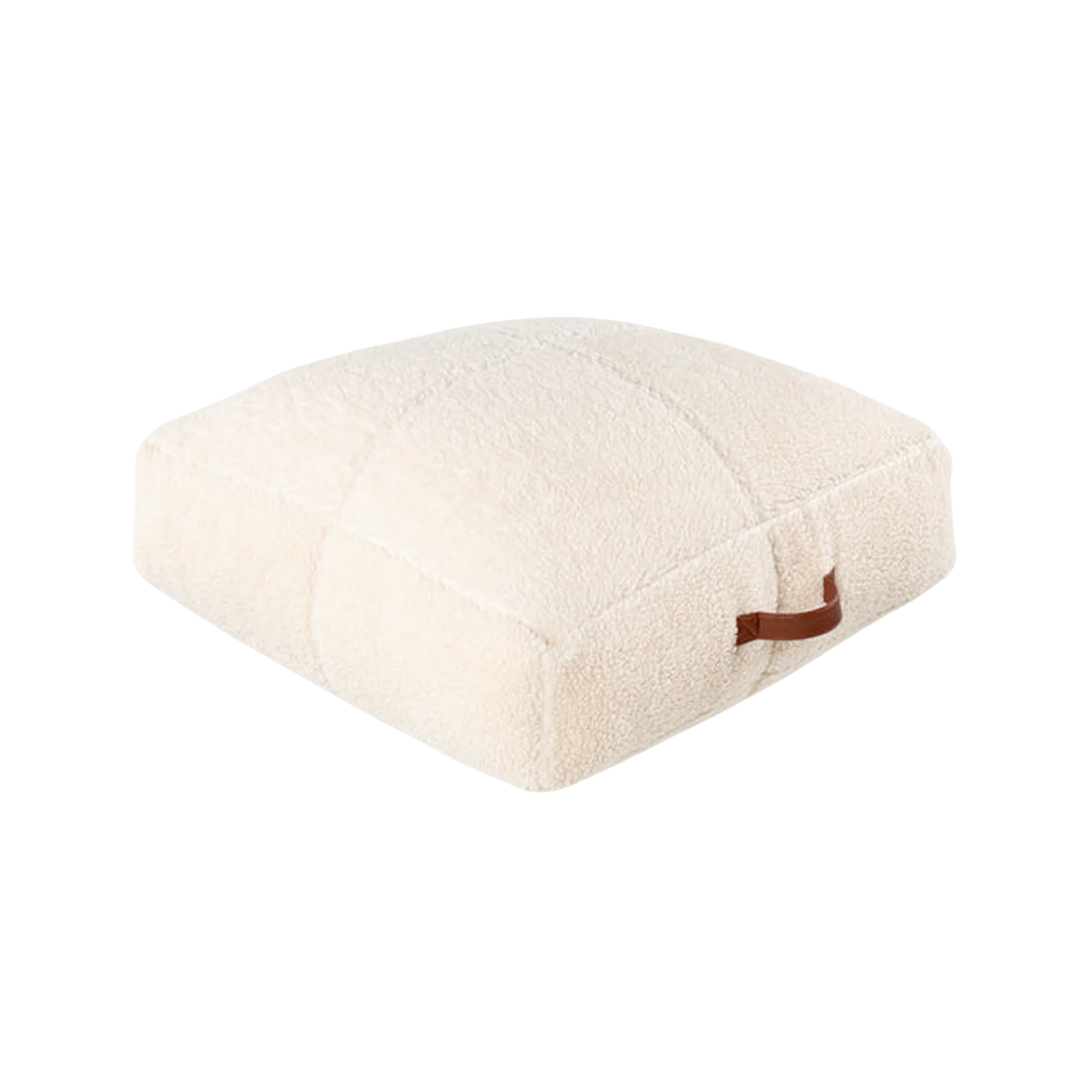 a white floor pillow with a brown leather handle