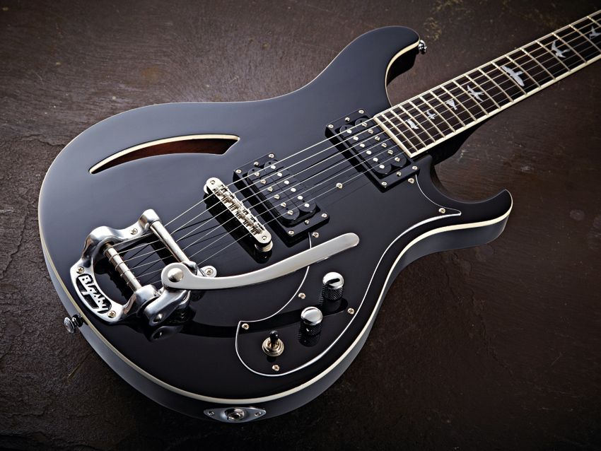 The PRS Custom Semi-Hollow features a Rickenbacker-style soundhole in its maple top.