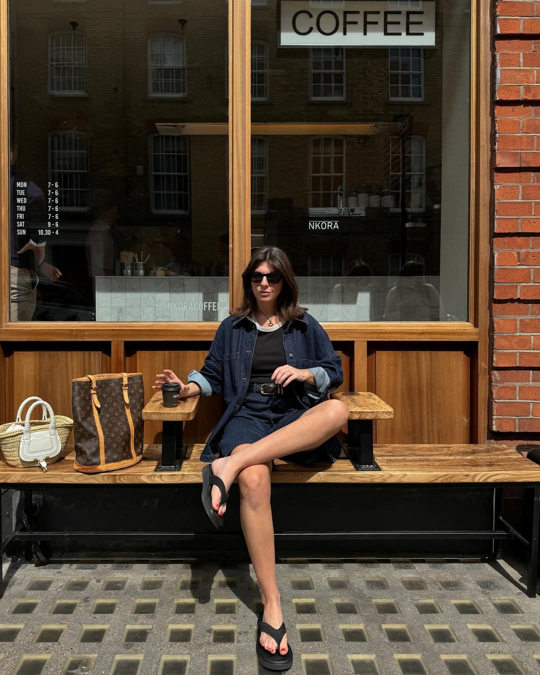 @francescasaffari wears denim Bermuda shorts, a tank top, denim jacket and black flip-flops