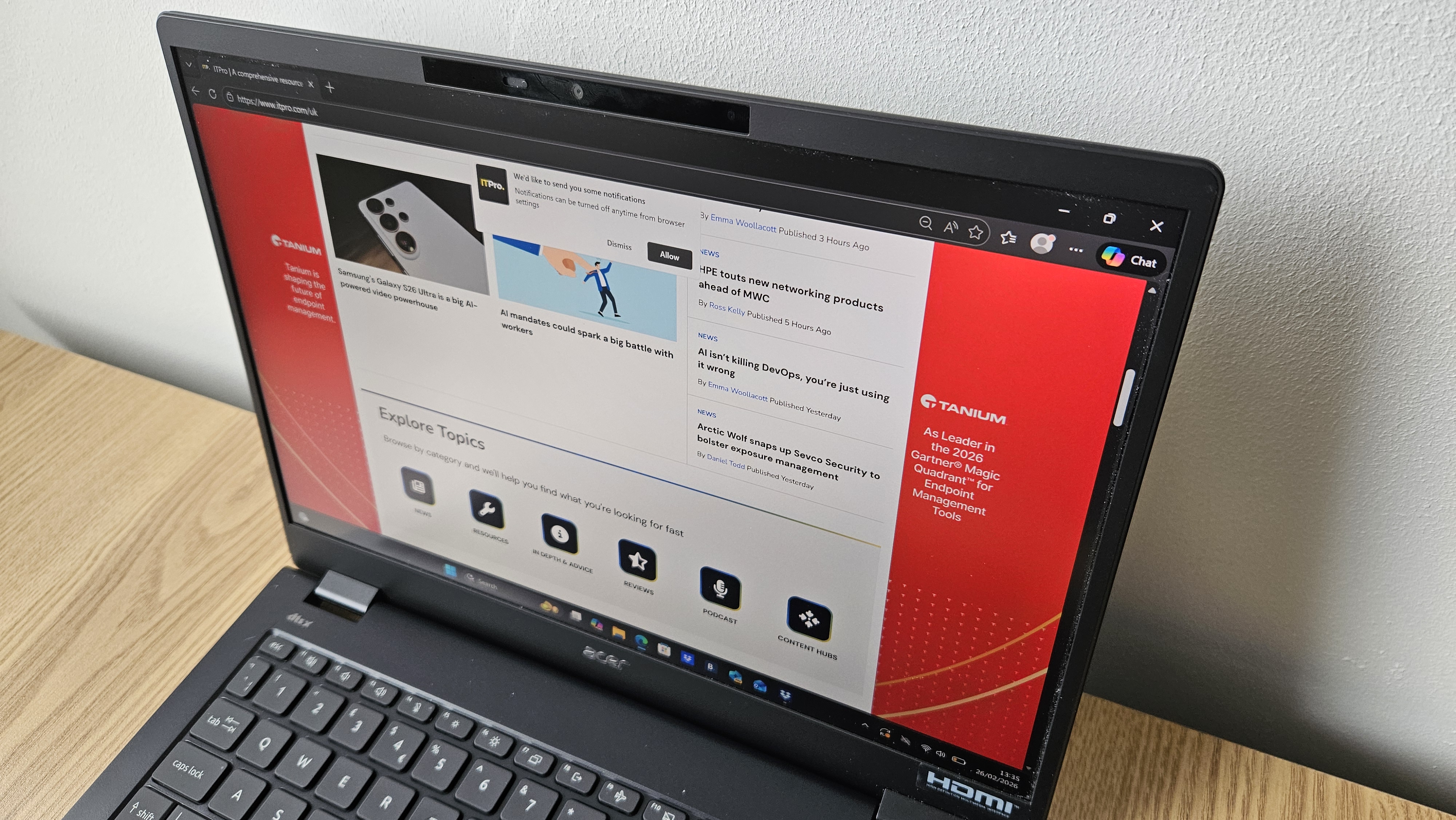 The Acer TravelMate P6 14 AI on a desk