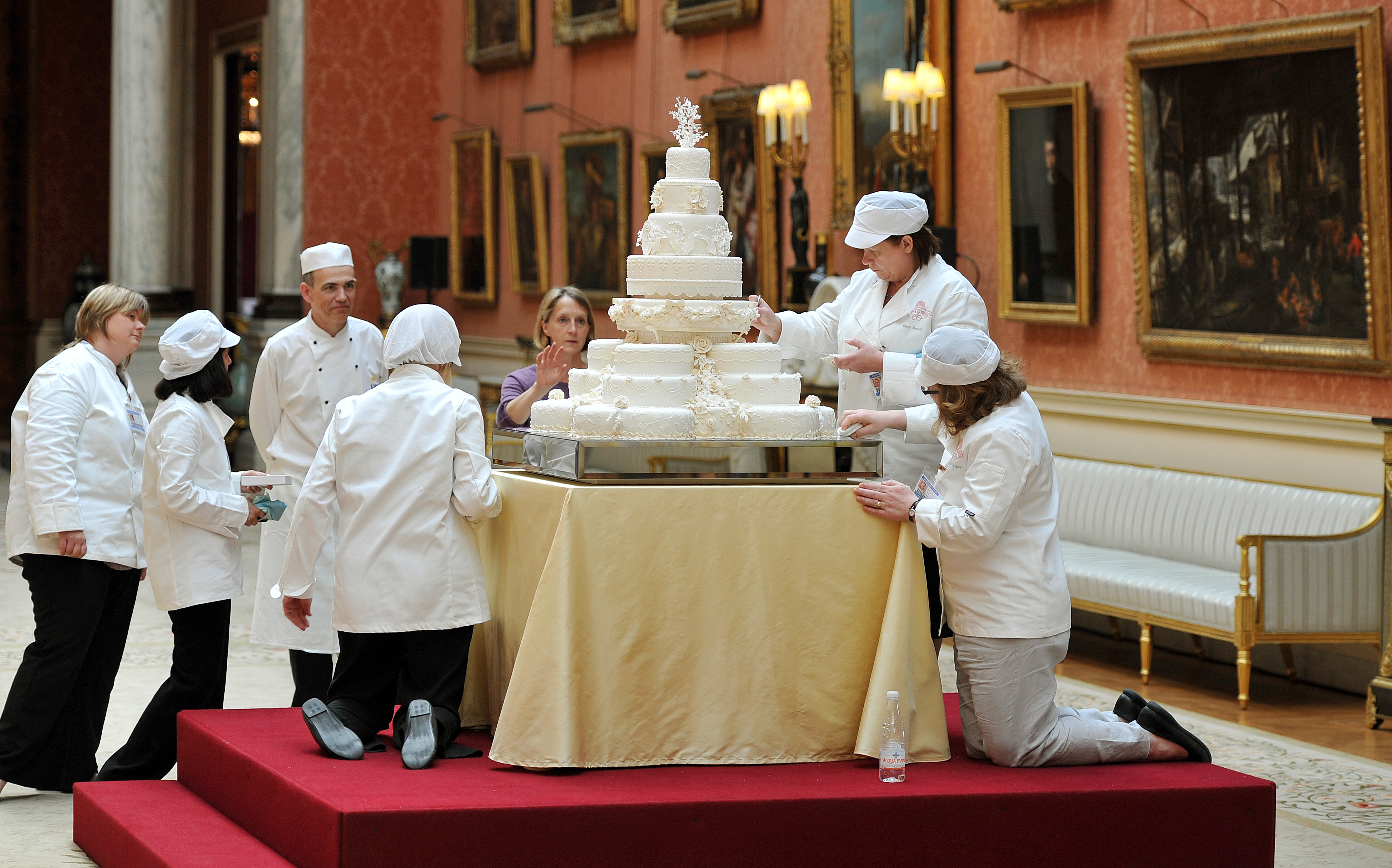 The team led by Fiona Cairns (not in picture) that made the Royal wedding cake Buckingham Palace in central London on April, 29, 2011. (Photo credit should read JOHN STILLWELL/AFP via Getty Images)