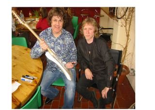 Gary Moore (left) with the signed Fender Stratocaster