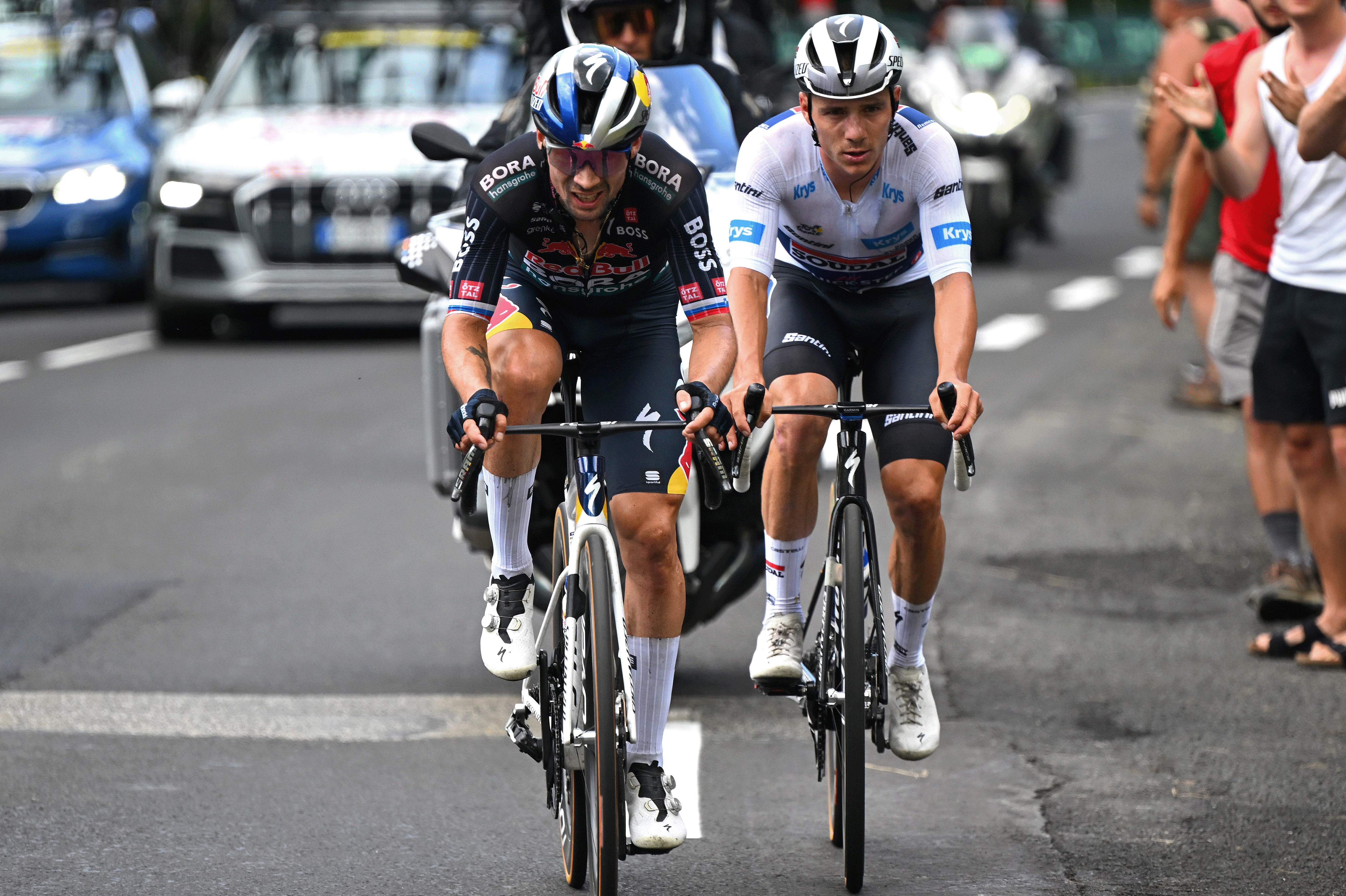 LE-LIORAN, FRANCE - JULY 10: (L-R) Primoz Roglic of Slovenia and Team Red Bull – BORA – hansgrohe and Remco Evenepoel of Belgium and Team Soudal Quick-Step - White best young jersey compete during the 111th Tour de France 2024, Stage 11 a 211km stage from Evaux-les-Bains to Le Lioran (1239m) / #UCIWT / on July 10, 2024 in Le Lioran, France. (Photo by Tim de Waele/Getty Images)