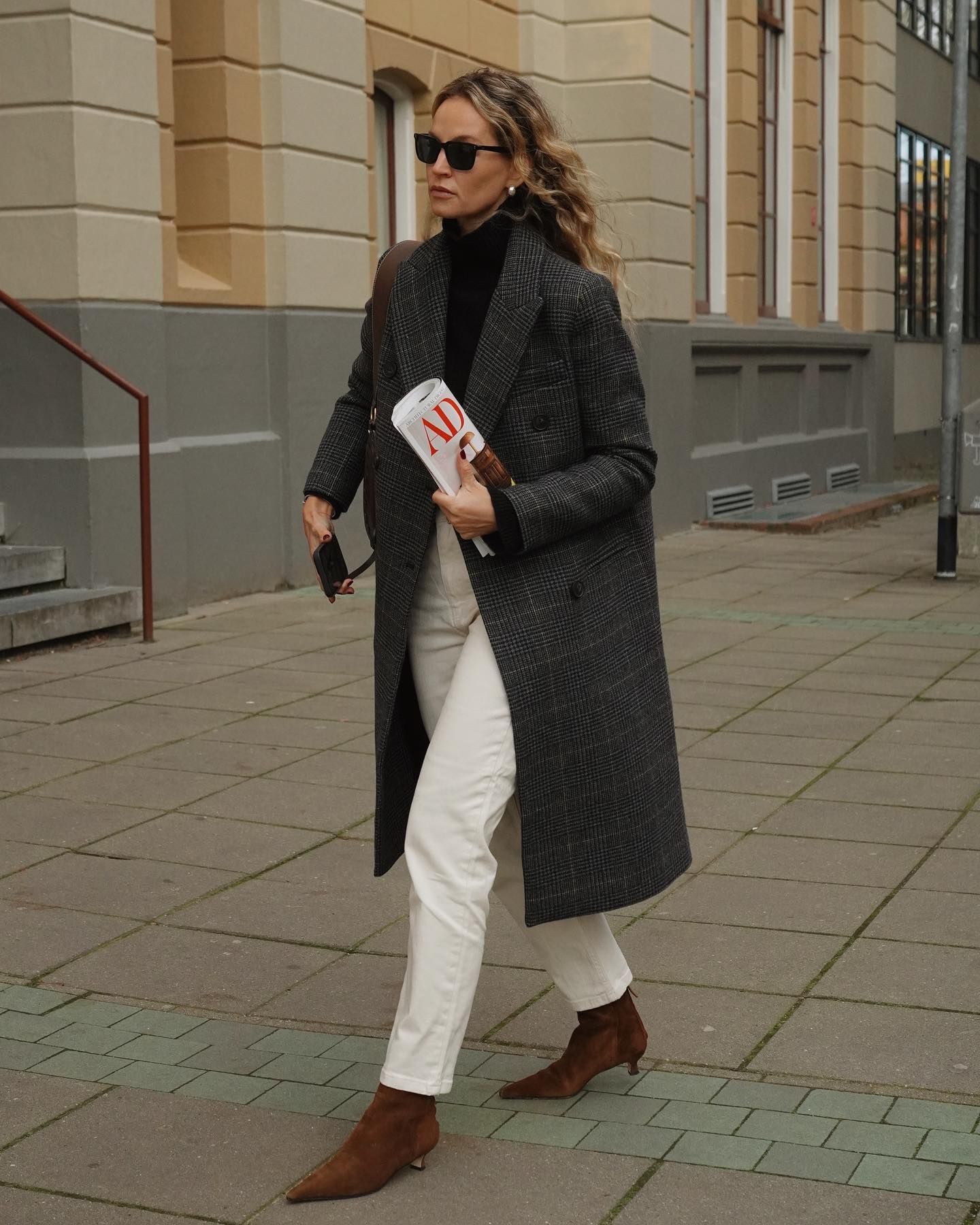Influencer styles brown suede boots.