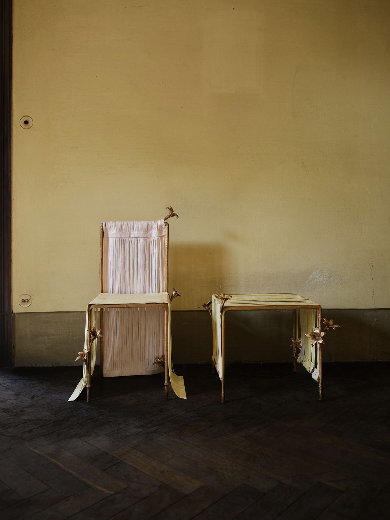 bronze furniture draped in pastel ribbons