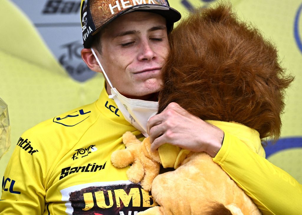 JumboVisma teams Danish rider Jonas Vingegaard celebrates on the podium with the overall leaders yellow jersey after the 11th stage of the 109th edition of the Tour de France cycling race 1517 km between Albertville and Col du Granon Serre Chevalier in the French Alps on July 13 2022 Photo by AnneChristine POUJOULAT AFP Photo by ANNECHRISTINE POUJOULATAFP via Getty Images